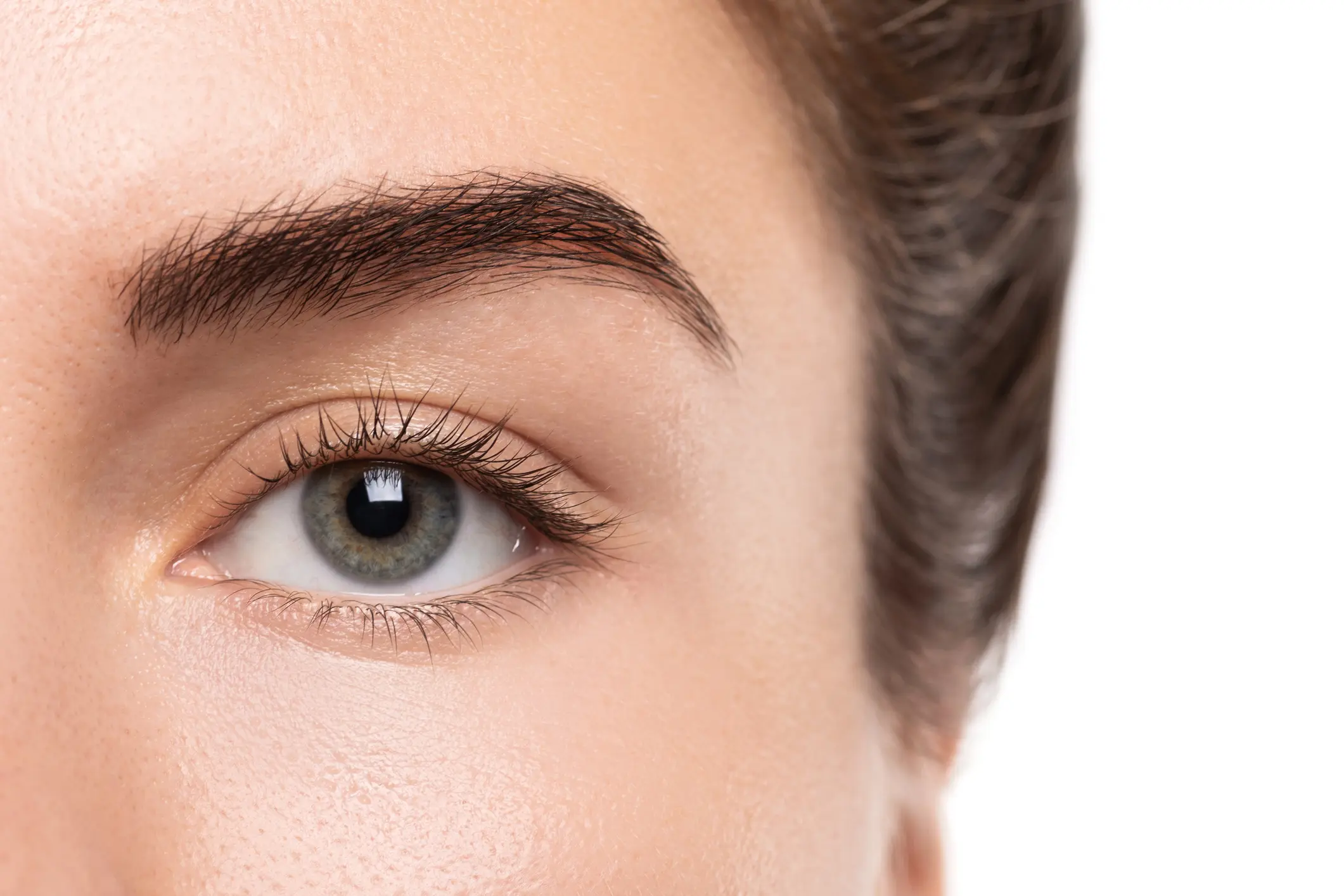 Closeup of young female eye without makeup Breast Lift in Middletown, NJ